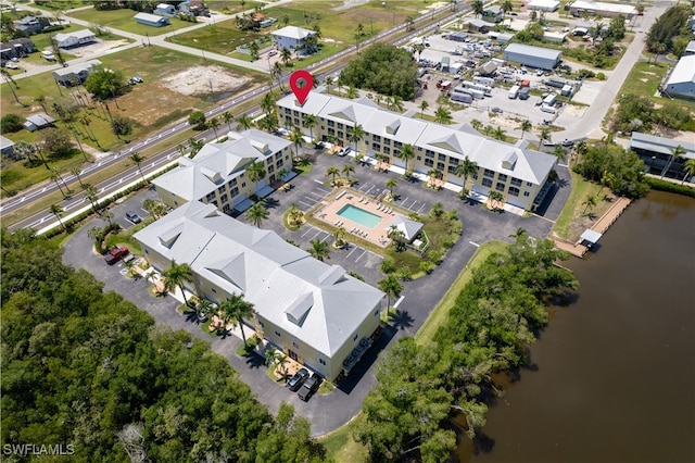 birds eye view of property with a water view