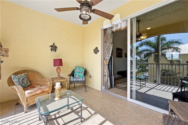 exterior space featuring light tile patterned floors and ceiling fan