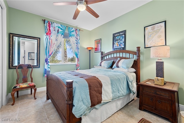 bedroom with ceiling fan and light tile patterned flooring