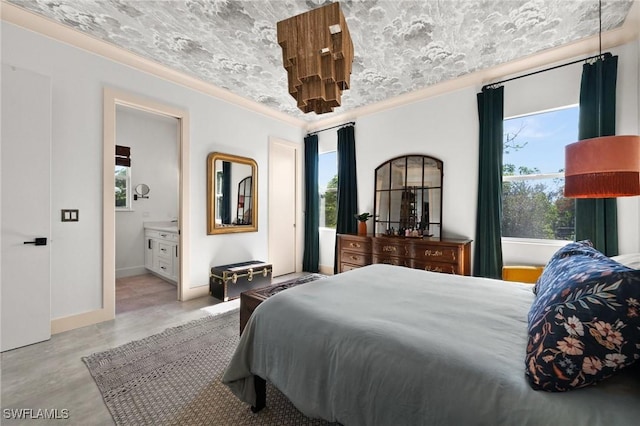 bedroom with ensuite bathroom and crown molding