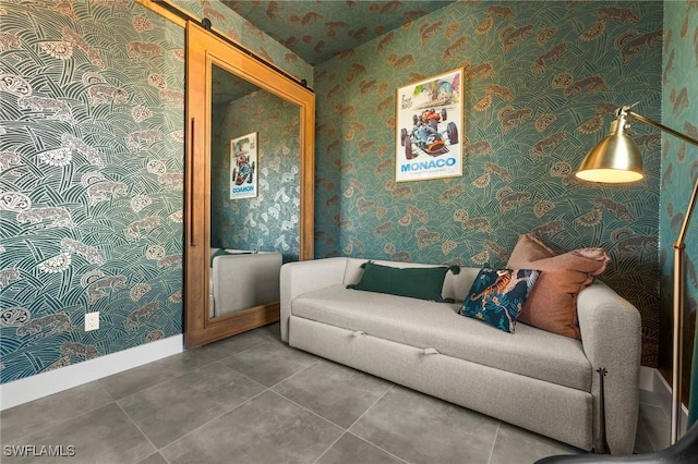 tiled living room featuring a barn door