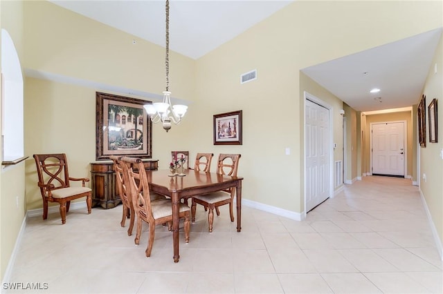 tiled dining space with an inviting chandelier