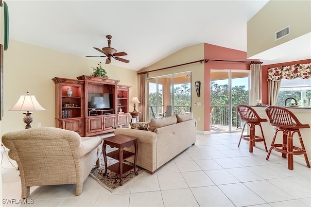 tiled living room featuring ceiling fan, lofted ceiling, and sink