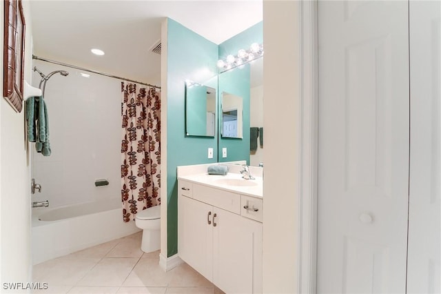 full bathroom featuring tile patterned floors, vanity, toilet, and shower / tub combo with curtain