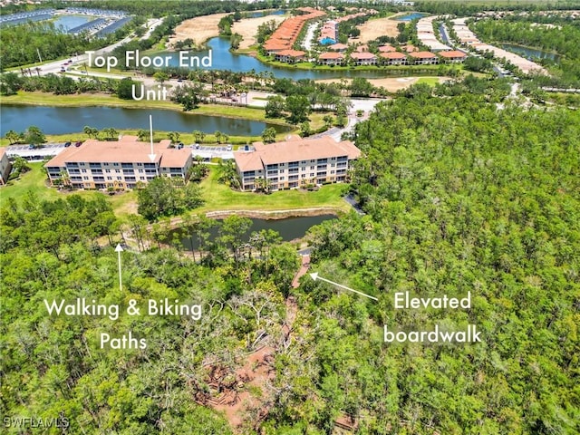 birds eye view of property featuring a water view