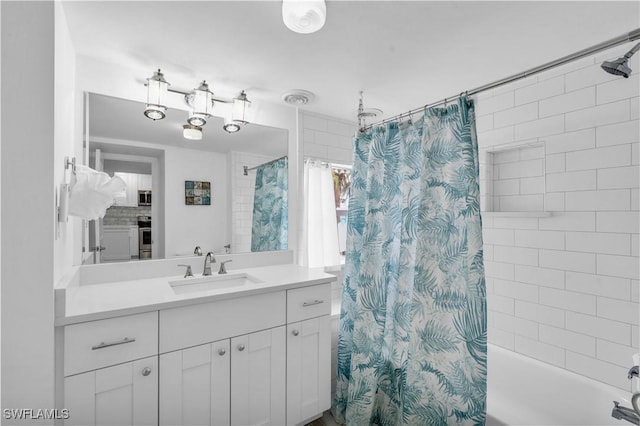 full bath featuring shower / tub combo with curtain and vanity