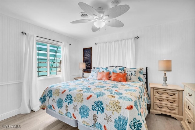 bedroom featuring ceiling fan and light wood-style flooring