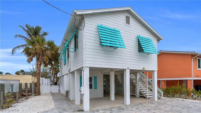 back of house with stairway