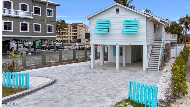 back of property featuring a carport