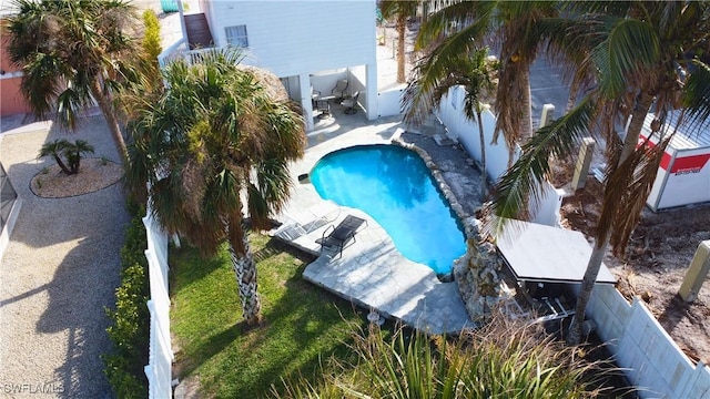 view of pool with a fenced in pool, a fenced backyard, and a patio