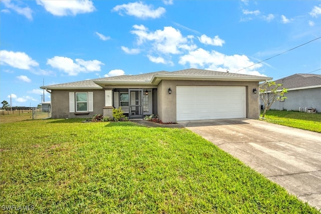 view of front of house with a front lawn and a garage