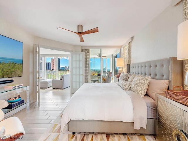 bedroom featuring french doors, access to outside, light hardwood / wood-style flooring, and ceiling fan