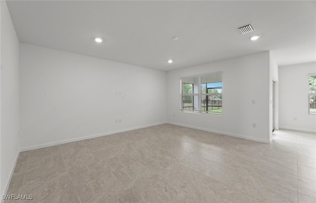 spare room with a wealth of natural light