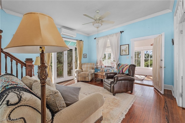 living room with dark hardwood / wood-style floors, an AC wall unit, ceiling fan, and crown molding