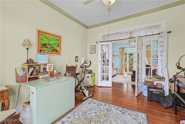 office space with ceiling fan, dark hardwood / wood-style flooring, french doors, and ornamental molding