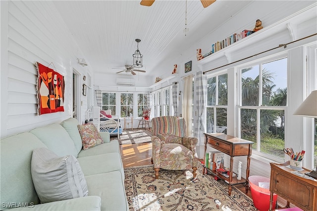 sunroom / solarium with a wall mounted air conditioner and ceiling fan