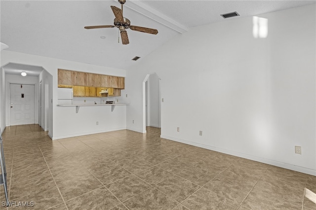 unfurnished living room with tile patterned floors, ceiling fan, lofted ceiling with beams, and a textured ceiling