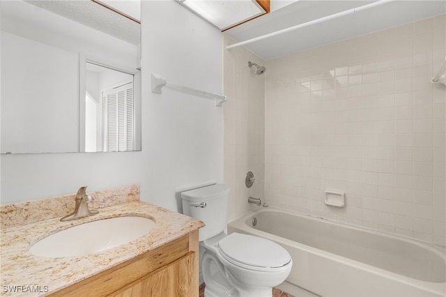 full bathroom featuring vanity, toilet, and tiled shower / bath