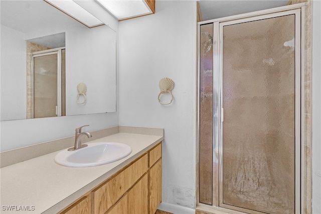 bathroom featuring vanity and walk in shower