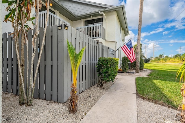 view of home's exterior featuring a yard