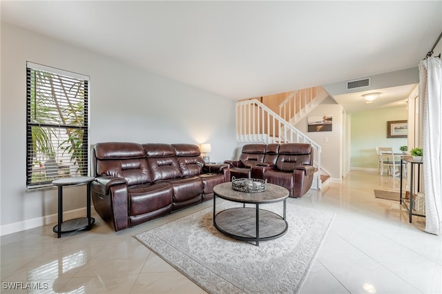 living room with light tile patterned flooring