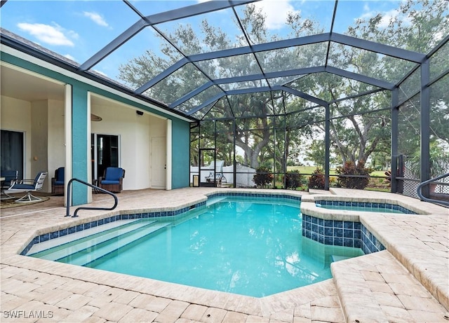 view of swimming pool featuring glass enclosure and a patio area