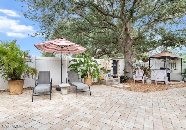 view of patio / terrace with a gazebo and grilling area