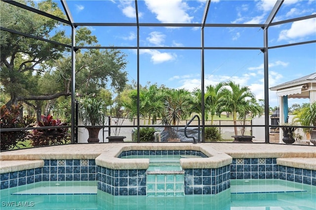 view of swimming pool with a pool with connected hot tub and glass enclosure