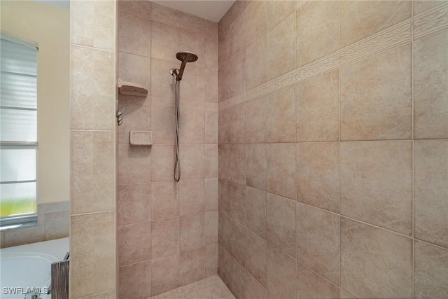 bathroom with a tile shower