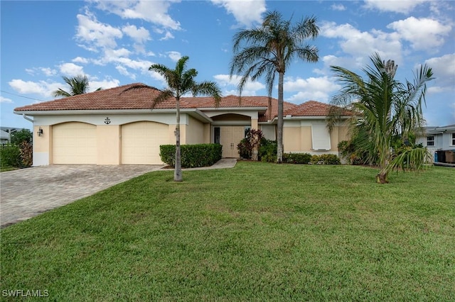 view of front of house featuring a garage and a front yard