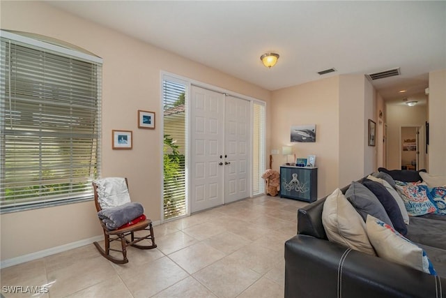 tiled foyer featuring plenty of natural light