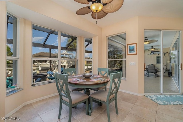 dining room with ceiling fan and light tile patterned flooring