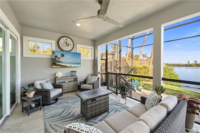 sunroom with ceiling fan and a healthy amount of sunlight