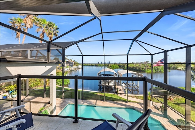 view of pool featuring a water view and a lanai