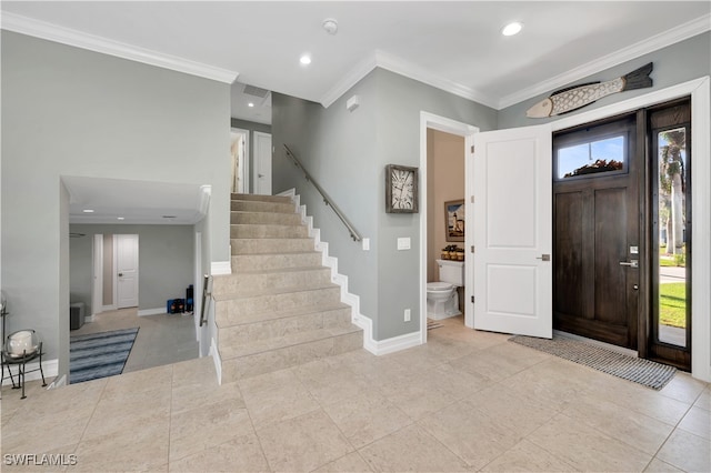 entryway featuring ornamental molding