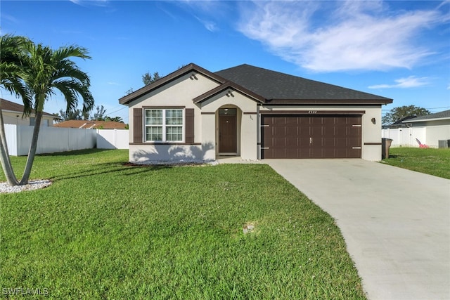 ranch-style home with a garage and a front yard