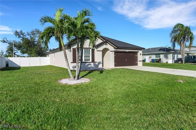 ranch-style home with a garage and a front yard