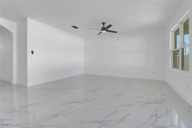 unfurnished room with ceiling fan