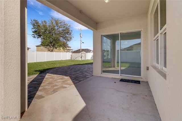 view of patio / terrace with a shed