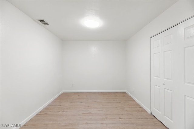 empty room with light hardwood / wood-style floors