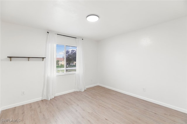 spare room with light wood-type flooring