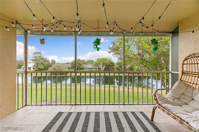 sunroom with a water view