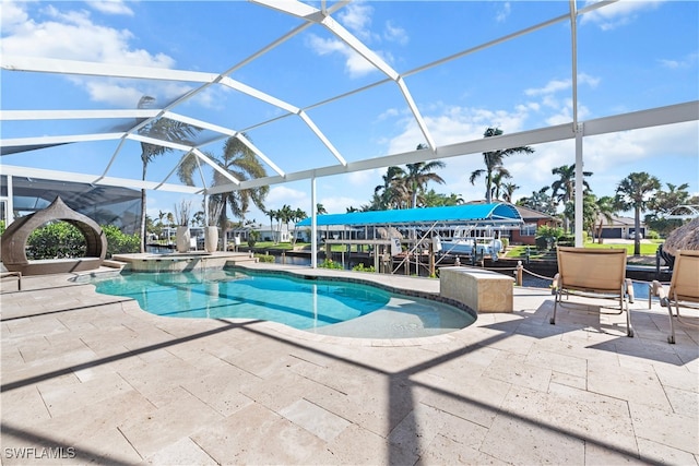 view of swimming pool with a lanai and a patio area