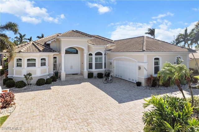 mediterranean / spanish-style house featuring a garage