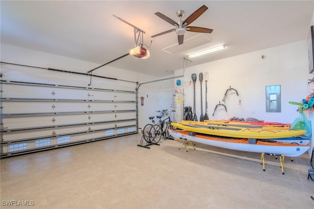 garage featuring a garage door opener, electric panel, and water heater