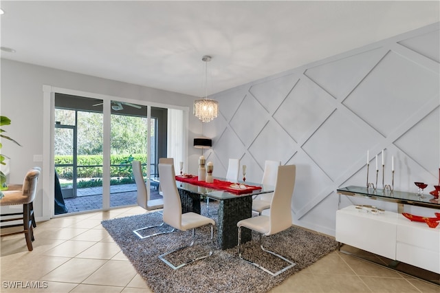 dining area featuring a chandelier and light tile patterned floors