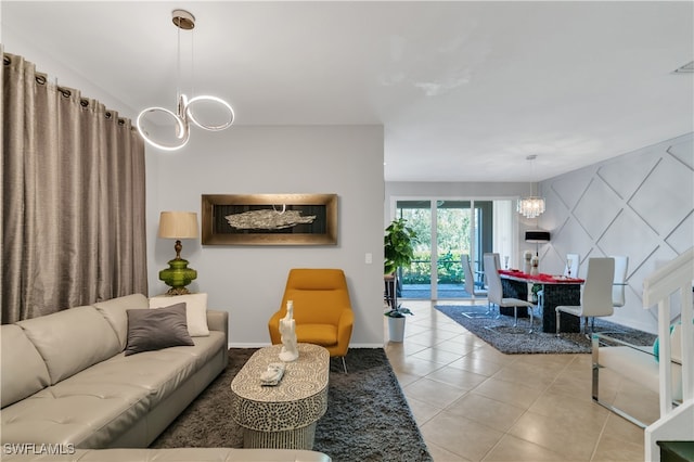 living room with a notable chandelier and light tile patterned flooring