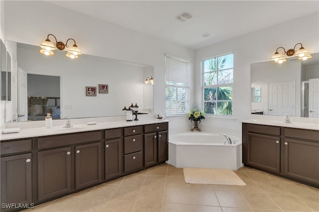 bathroom with vanity, independent shower and bath, and tile patterned flooring