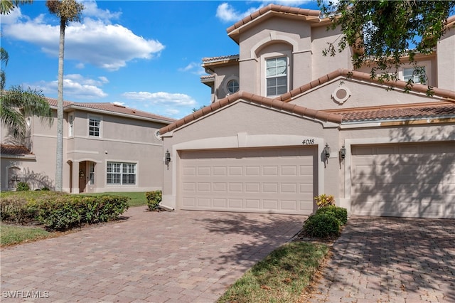 mediterranean / spanish-style house featuring a garage