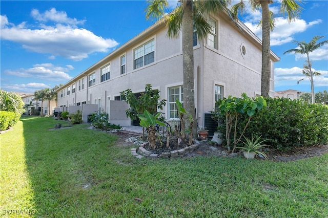 view of side of home featuring a lawn